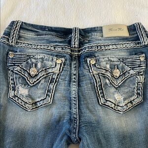 Miss Me Distressed Blue Jeans with Embellished Pockets boot cut.